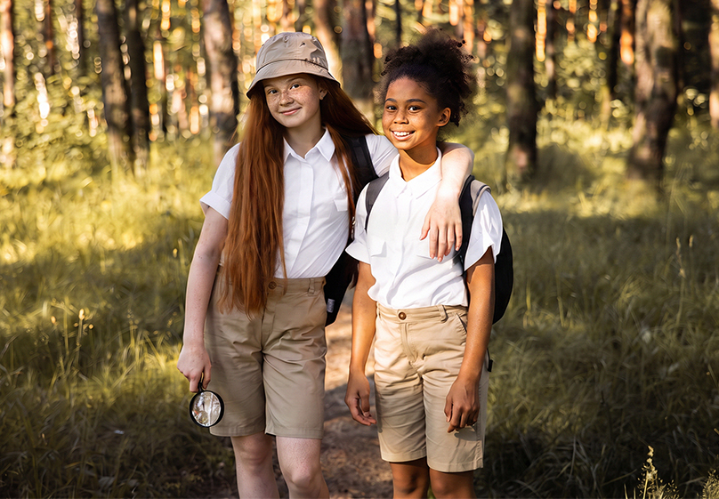 Two Girl Scouts outdoors